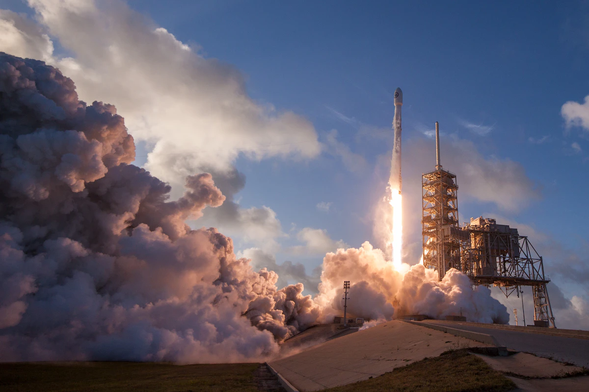 Long-exposure arc of a rocket launch and landing